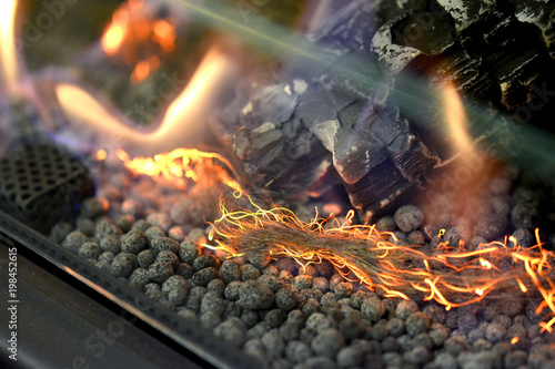 Modern bio fireplot fireplace on ethanol gas. Smart ecological alternative technologies. Contemporary biofuel on ethanol close-up. Energy saving innovation. Interior inside house. Decorated fireplace. photo