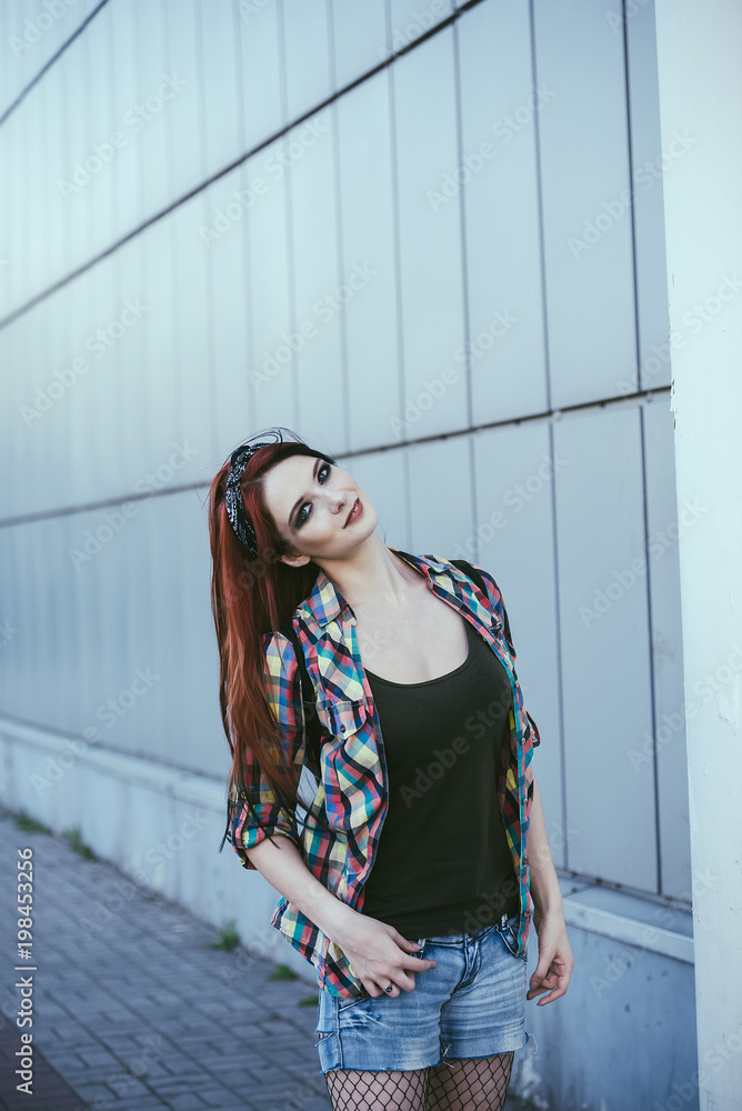 Non formal hipster girl in denim shorts 