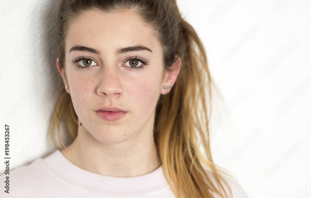 Portrait of a teenager looking at the camera. Vertical shot with natural light Portrait of a teenager looking at the camera. Vertical shot with natural light