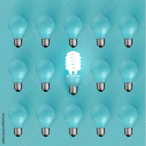 Energy saver lightbulb among old ones, vector illustration