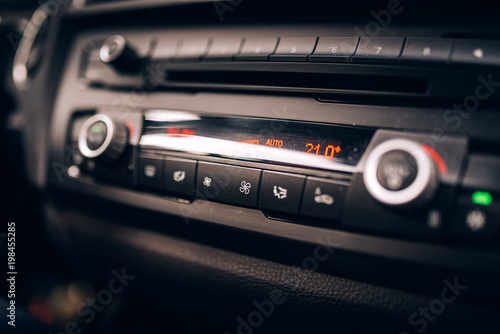 Car clima controls, radio dashboard and cockpit close up photo