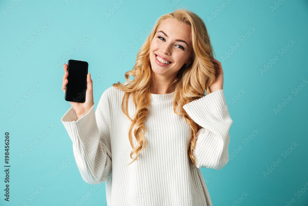 Portrait of a beautiful young blonde woman in sweater Portrait of a beautiful young blonde woman in sweater