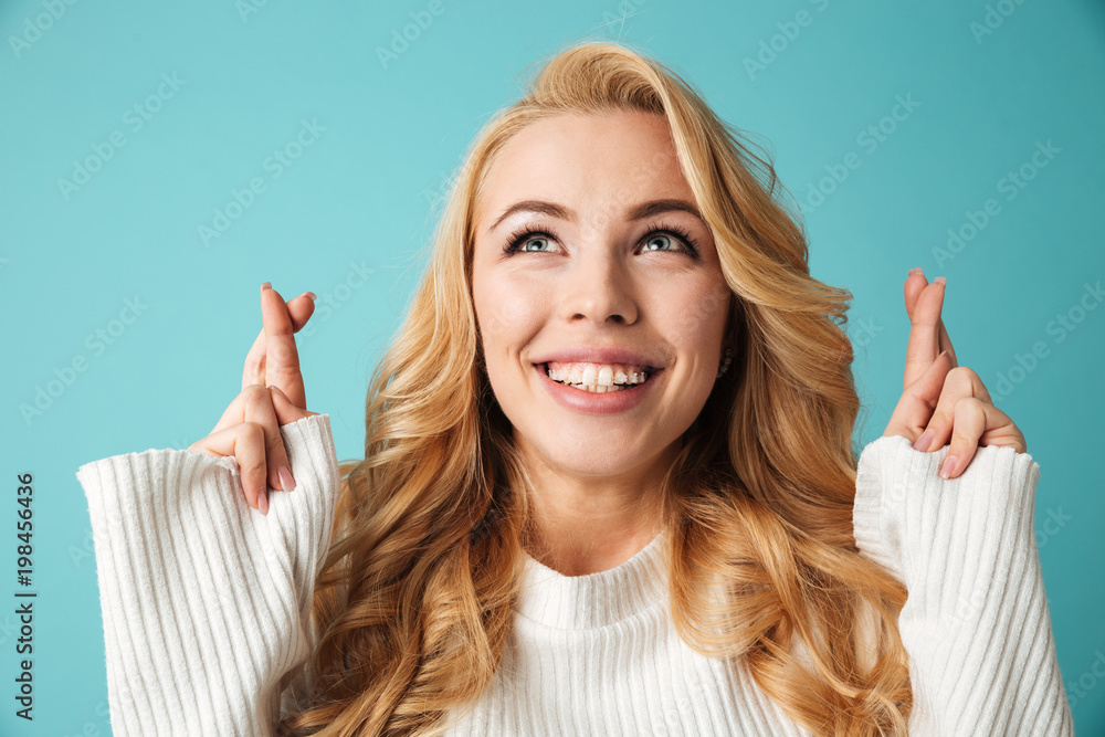 Portrait of a smiling young blonde woman in sweater Portrait of a smiling young blonde woman in sweater