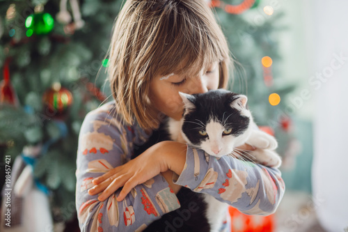 The pretty girl embarcing a cat