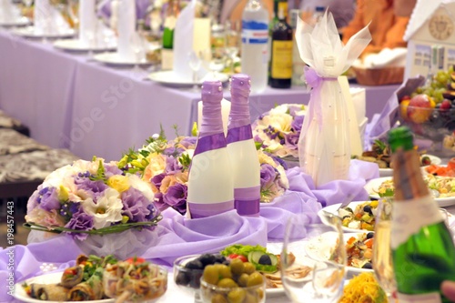 Wedding Table with Decorated Champagne Bottles