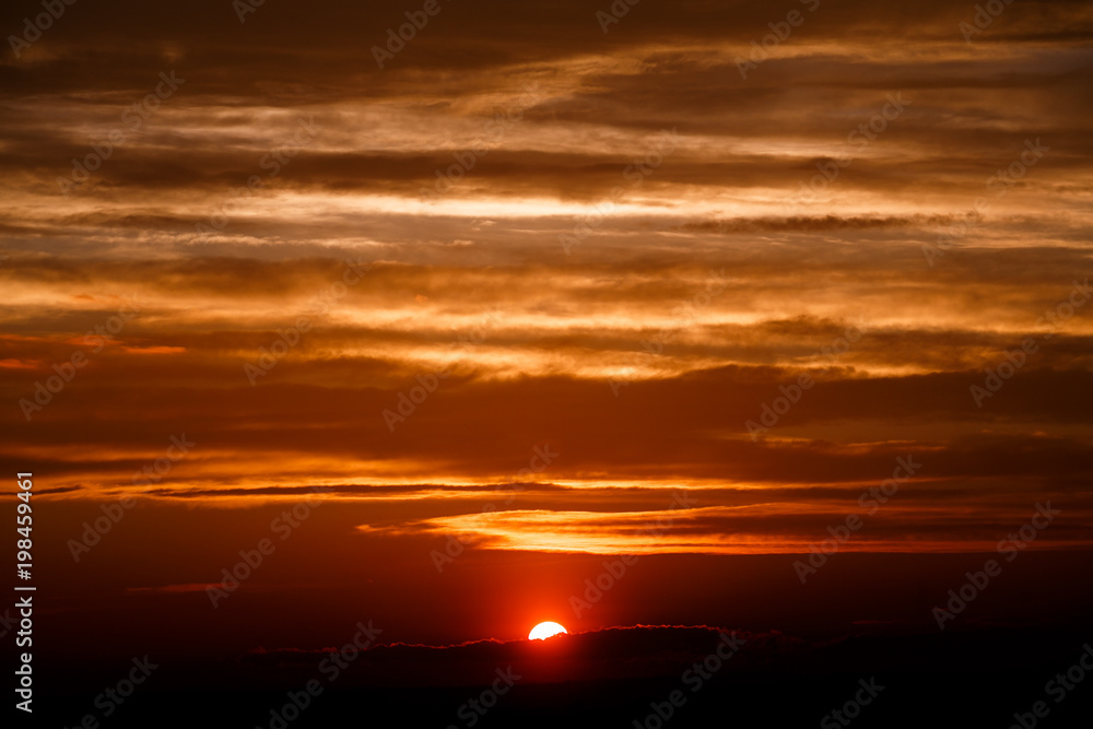 amazing sunset wallpaper. beautiful red sunset and clouds in orange sky, dramatic view. fascinating image. beautiful nature moments, breathtaking scenery