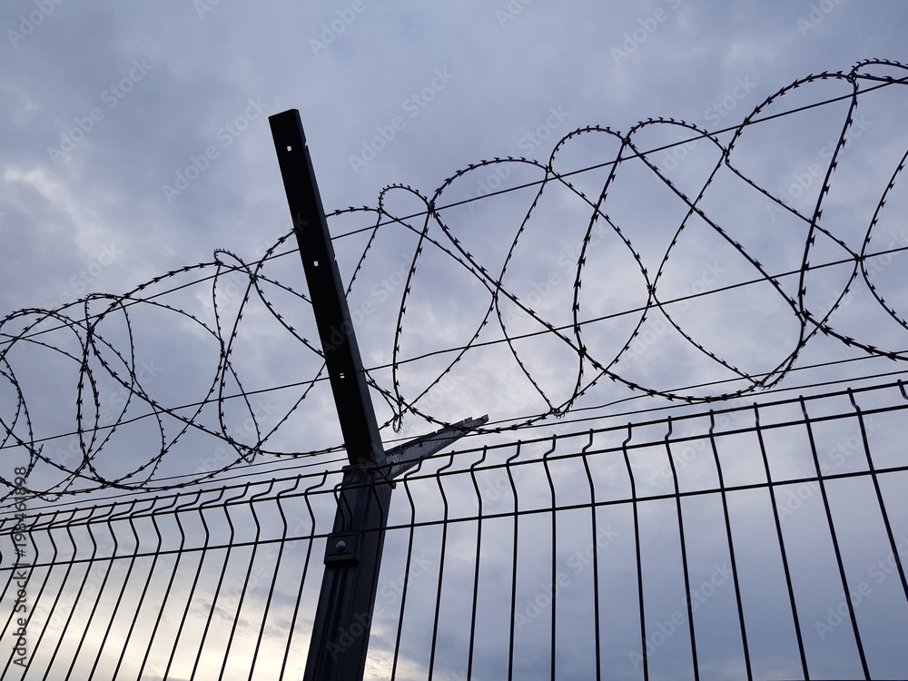 Fence with a barbed wire at the airport of Sochi.