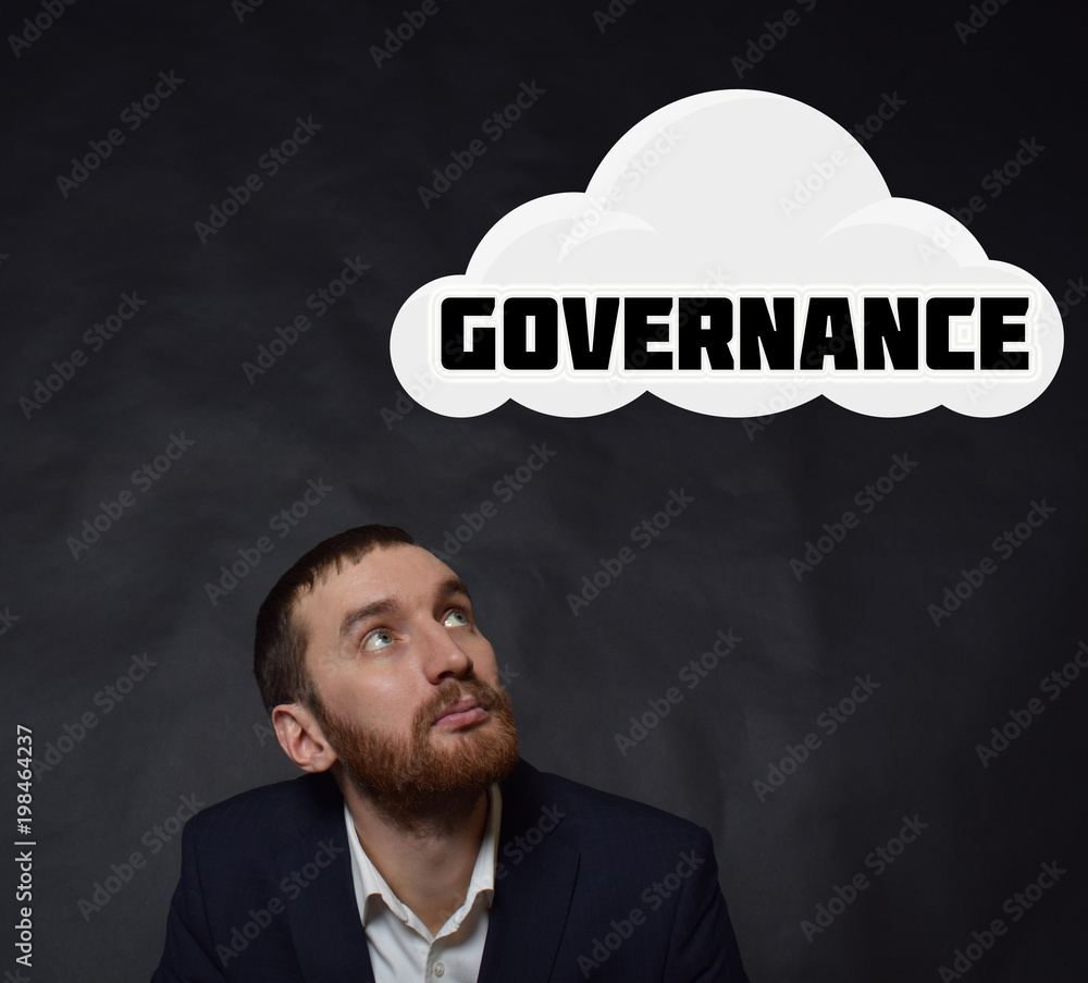 Above the businessman hangs a cloud with the inscription:GOVERNANCE Above the businessman hangs a cloud with the inscription:GOVERNANCE
