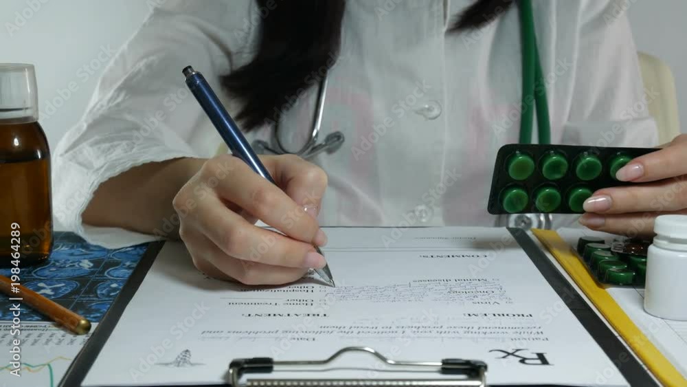 A young nurse is working in the office with a laptop. The doctor diagnoses with rengen in the modern office. Filling the medicinal form with a pharmacist. A young nurse is working in the office with a laptop. The doctor diagnoses with rengen in the modern office. Filling the medicinal form with a pharmacist.