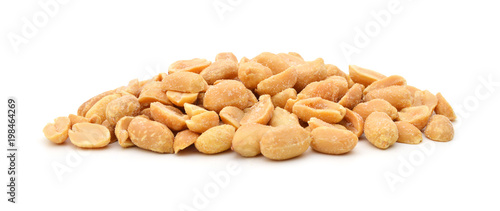 Peeled salted peanuts isolated on white background