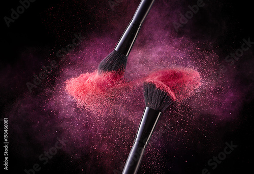 Fotografie Cosmetic Brushes And Explosion Colorful Powders.