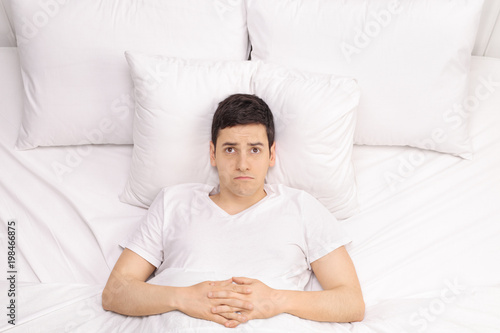 Photography Pensive young man in bed
