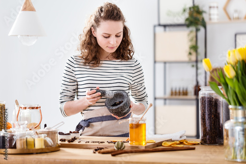 Girl grinding herbs