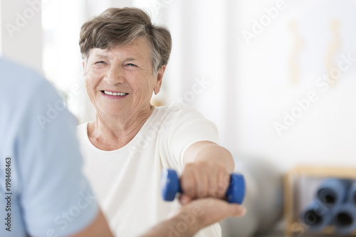 Senior woman exercising with weights