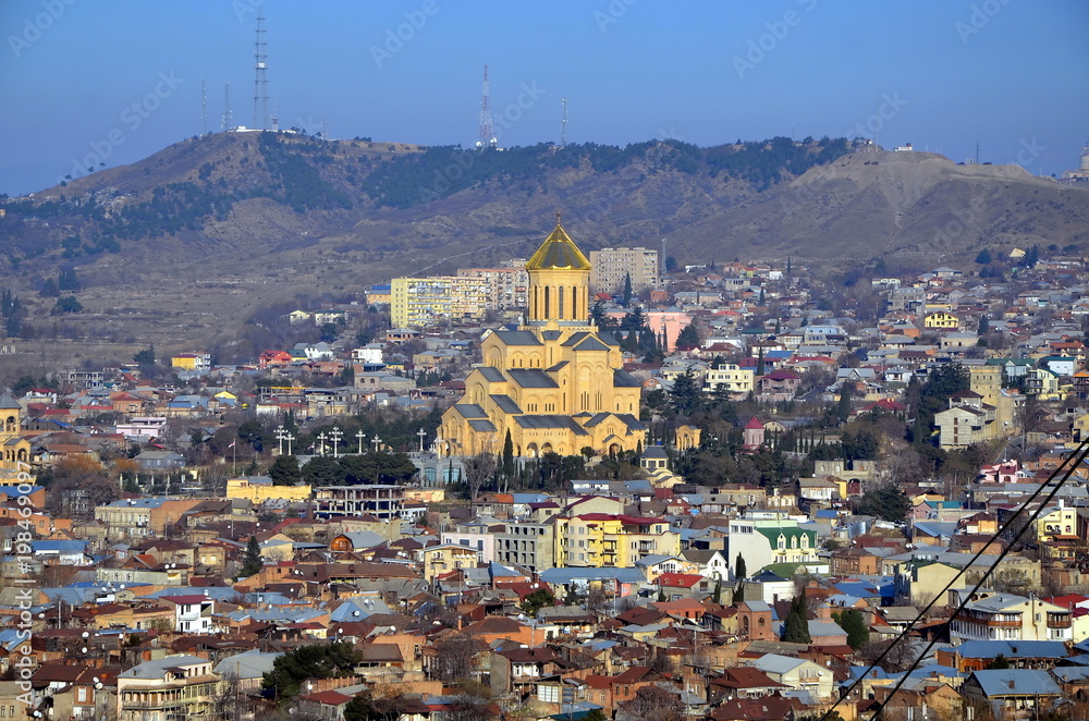 Top view of Tbilisi  from Narikala fortress. Holy Trinity Cathedral of Tbilisi commonly known as Sameba in Tbilisi, capital of Georgia
