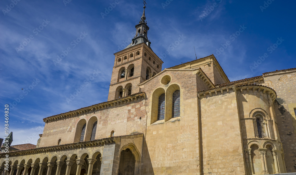 Obraz premium Exterior of a Romanesque style Christian church, City of Segovia, famous for its Roman aqueduct, in Spain