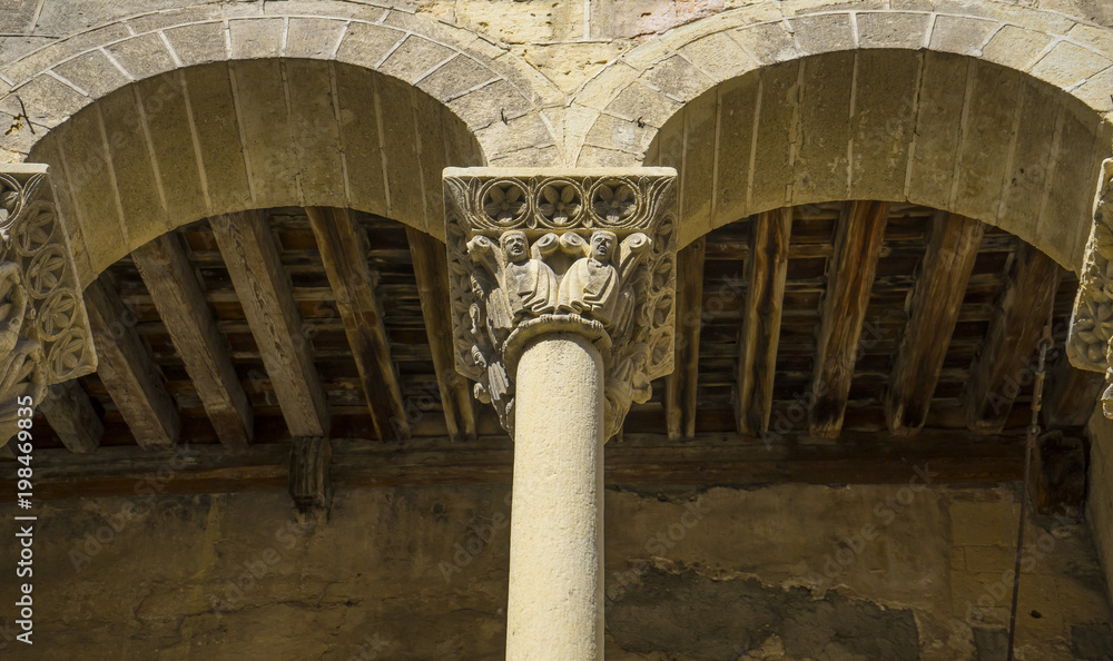 Arches with capitals in stone, City of Segovia, famous for its Roman aqueduct, in Spain