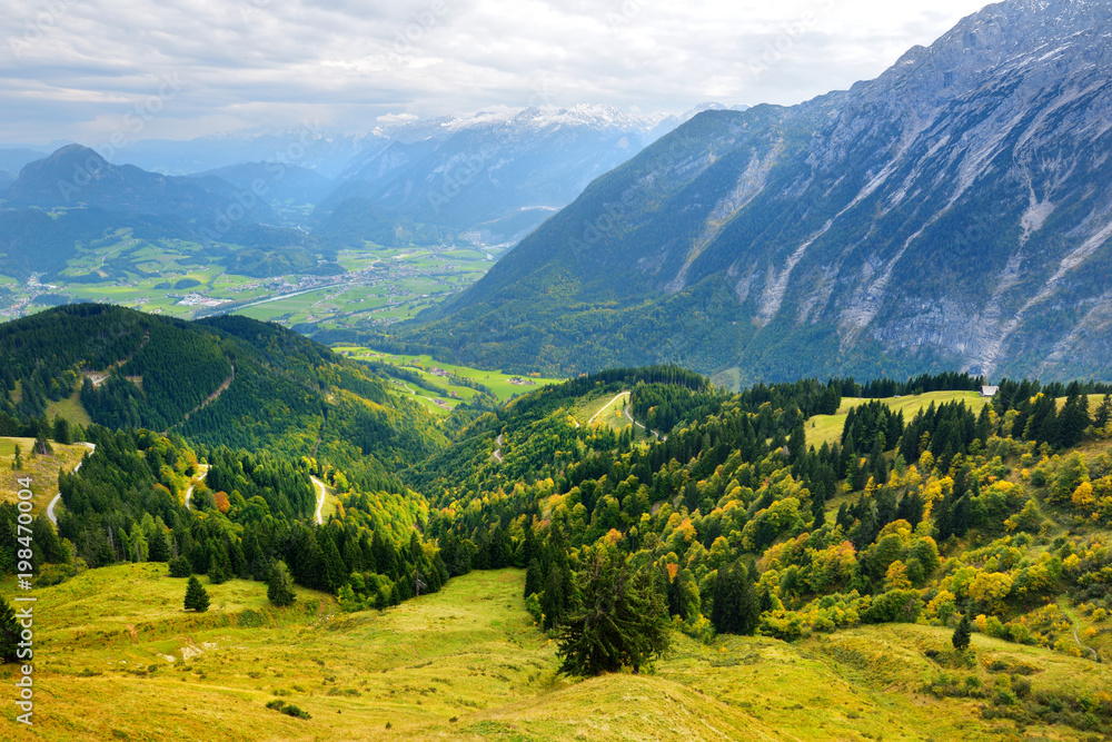 Breathtaking lansdcape of mountains, forests and small Bavarian villages in the distance. Scenic view of Bavarian Alps with majestic mountains in the background.