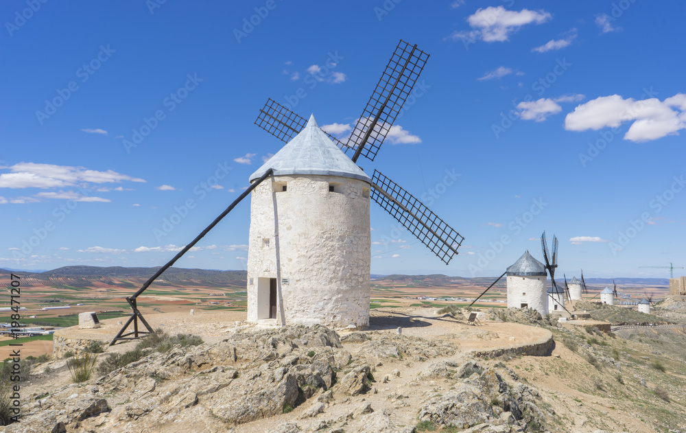 Beautiful summer above the windmills on the field in Spain Beautiful summer above the windmills on the field in Spain