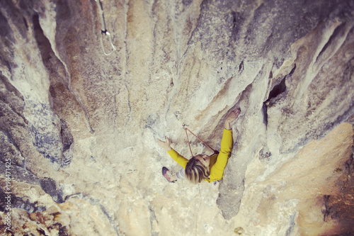 Rock-climbing in Turkey. The climber climbs on the route. Photo from the top.
