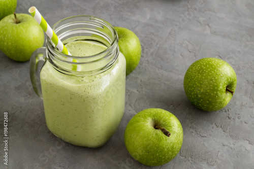 Healthy detox green smoothie in a mason jar.