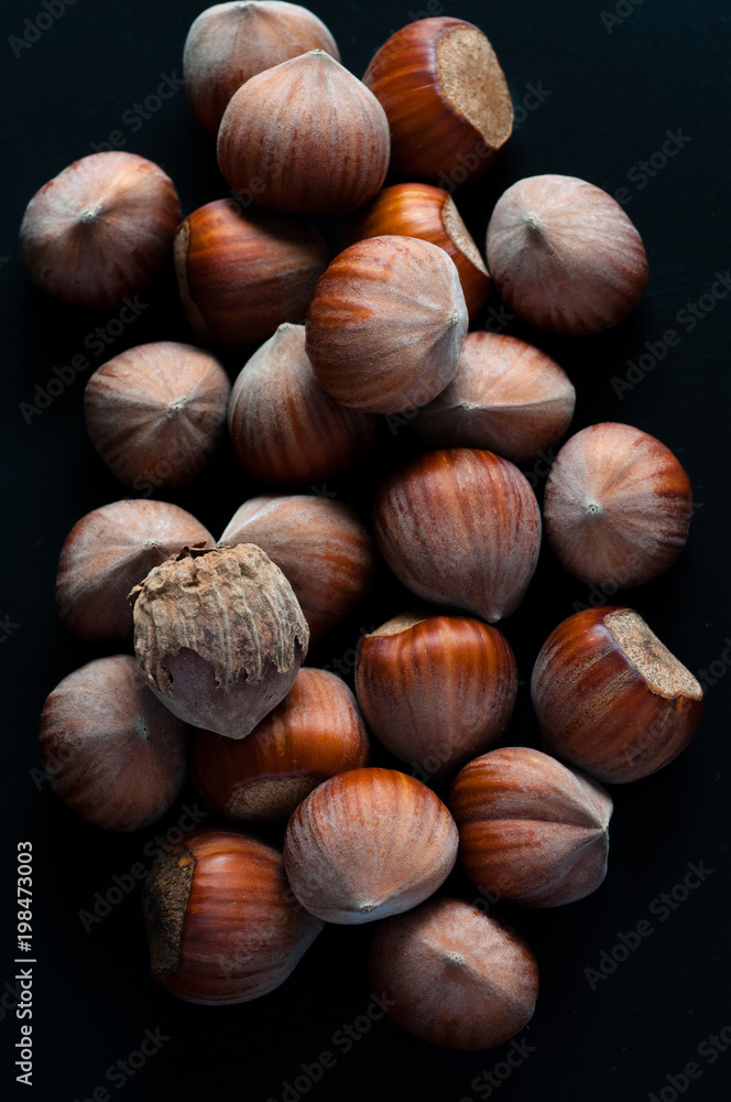 Dry brown hazel nuts background pattern. Close-up Texture. Dry brown hazel nuts background pattern. Close-up Texture.