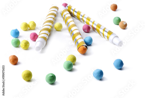 colorful balls and blowpipe isolated on white background photo