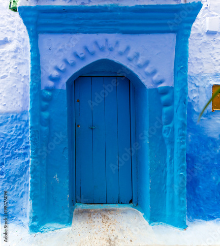 Old blue door on street in Chefchaouen © Kokhanchikov