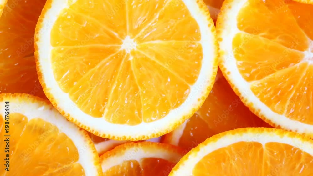 Slow rotation of fresh bright oranges (orange fruits) slices. Closeup. Slow rotation of fresh bright oranges (orange fruits) slices. Closeup.