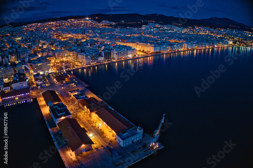 Aerial view of harbor and city Thessaloniki at night, Greece.