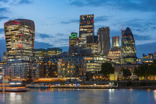 Thames embankment and london skyscrapers in City of London after sunset
