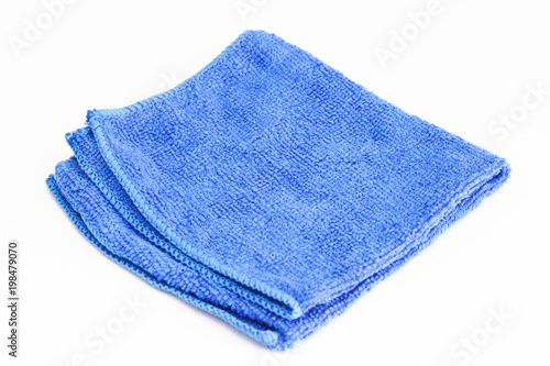 Blue folded microfiber cloth on white background