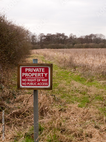 red wooden private property sign farm land no right of way no public access