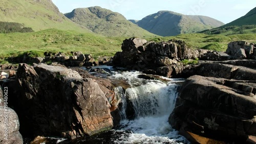 Dolly shot of the waterfall landscape in Glen Etive, Scotland - United Kingdom photo