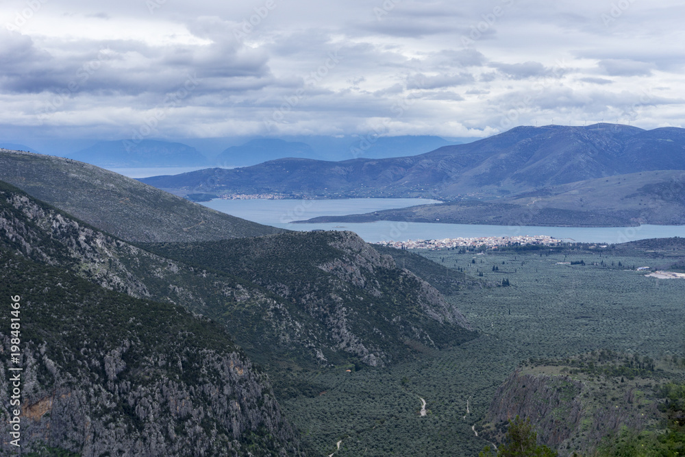 Delphi, Phocis - Greece. Panoramic view from Delphi town of the olive groves of Phocis and the Itea bay along with the villages Itea and Galaxidi