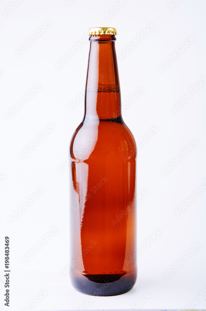 Full brown beer bottle isolated on white Full brown beer bottle isolated on white