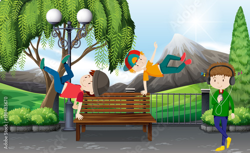 Three boys dancing in the park