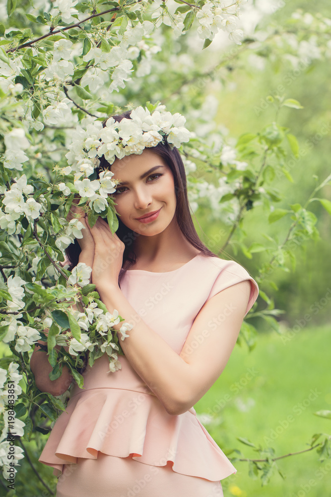 Beautiful Brunette Fashion Model Woman with Flowers Outdoor Beautiful Brunette Fashion Model Woman with Flowers Outdoor