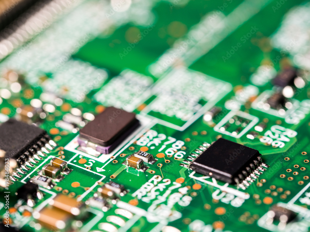 close-up of circuit board with integrated circuits, resistors and capacitors. close-up of circuit board with integrated circuits, resistors and capacitors.