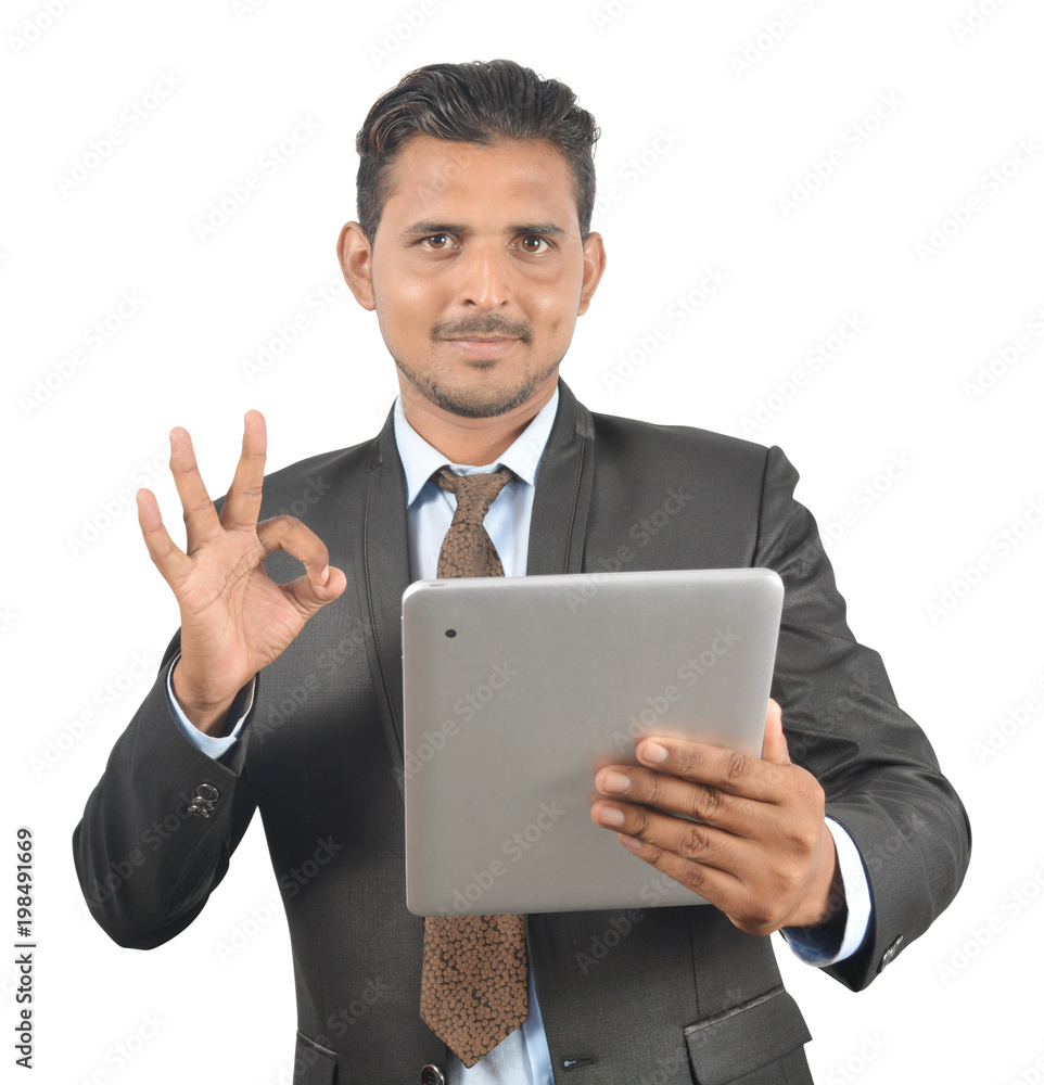 Man holding tablet pc with good sign isolated on white background professionally Man holding tablet pc with good sign isolated on white background professionally