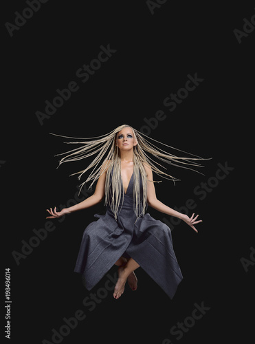Tableau sur toile Young woman yogi levitation and meditation concept.