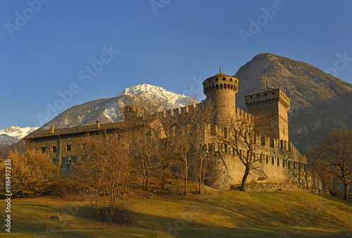 Fenis Castle in Aosta Valley at sunset. Fenis Castle is one of the castles guarding the Aosta Valley. Aosta Valley in Italy is full of medieval castles.