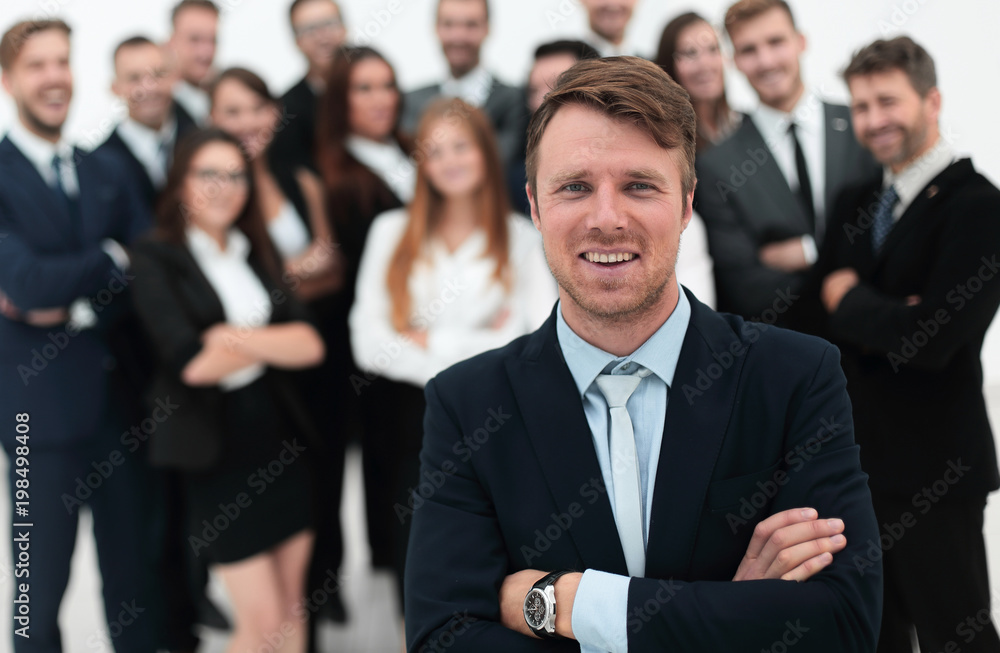 businessman standing in front of a large business team. businessman standing in front of a large business team.