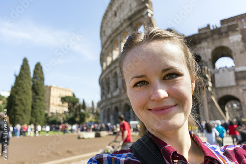 Canvas Print close-up portrait of girl in plaid shirt on Roman Colosseum background
