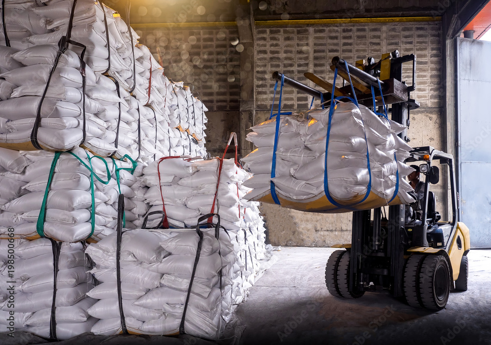 Sugar in bags handling to stacking in warehouse by forklift. Stock Photo |  Adobe Stock