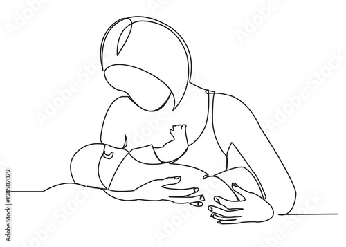 mother feeds a newborn baby