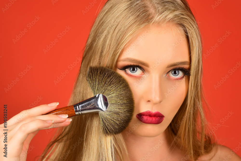 Pretty woman with a cosmetic brush. Young sexy beautiful female fashion model with makeup. Beautiful face, perfect skin. Skin care concept. Pretty woman with a cosmetic brush. Young sexy beautiful female fashion model with makeup. Beautiful face, perfect skin. Skin care concept.
