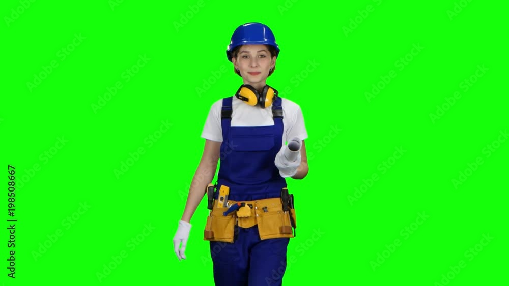 Designer of the construction site carries a drawing. Green screen Designer of the construction site carries a drawing. Green screen