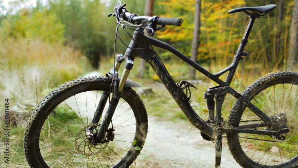 Mountain bike on bicycle trail in autumn forest. Slider stabilized video shot with Canon 5D mark III. Mountain bike on bicycle trail in autumn forest. Slider stabilized video shot with Canon 5D mark III.