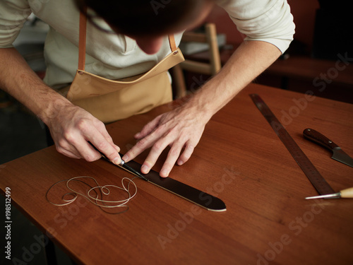 Chamfering with a leather belt by a tanner.